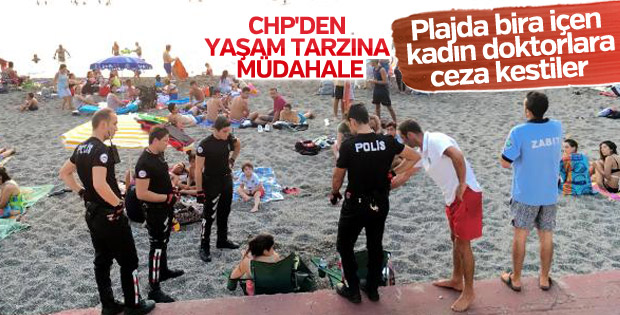 Plajda bira içen iki kadın doktora para cezası