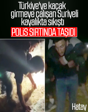 Hatay'da polis Suriyeliyi sırtında taşıdı