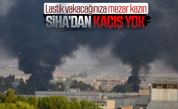 YPG'li teröristler SİHA'lara karşı lastik yakıyor