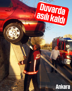 Freni boşalan araç duvarda asılı kaldı