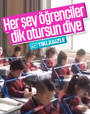 Çin'de öğrencilerin dik oturması için kurulan düzenek
