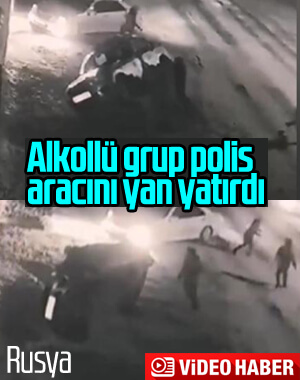 Rusya'da alkollü grup polis aracını yan yatırdı