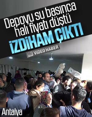 Su basan mağazada halılar için izdiham çıktı