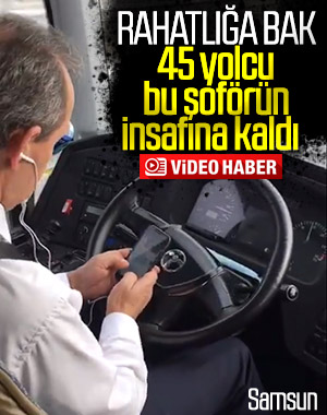 Yolcu taşıyan şoför, direksiyon başında telefonla oynadı