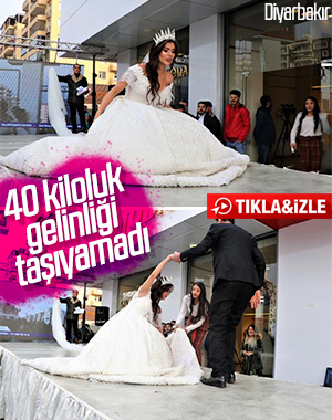 40 kilo ağırlığındaki gelinlikle yürüyemedi
