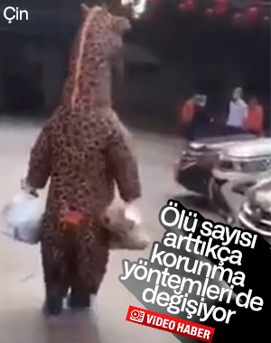 Koronavirüsten zürafa kostümüyle korunmaya çalışan Çinli