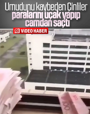 Vuhanlılar paralarını uçak yapıp camdan attı