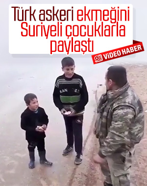 Suriye'de ekmeğini çocuklarla paylaşan Türk asker