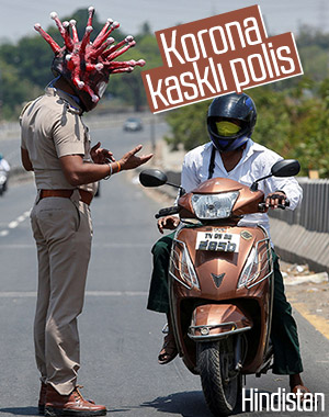 Hindistan'da polis, korona kaskı giydi
