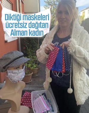 Alman kadın, diktiği maskeleri komşularına dağıtıyor