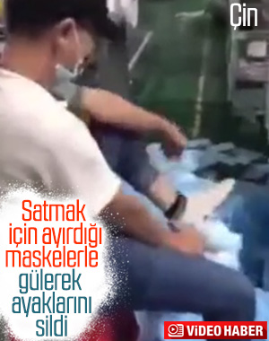 Ürettiği maskelerle ayağını silen Çinli