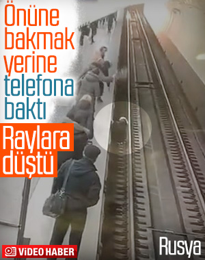 Rusya'da telefonuna bakarken raylara düşen kadın