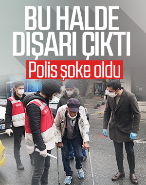 Koltuk değnekleriyle dışarıya çıkan yaşlı adam