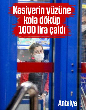 Kasiyerin yüzüne kola dökerek marketi soydu