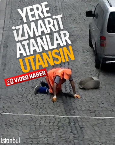 Temizlik görevlisi sigara izmaritlerini elleriyle topladı