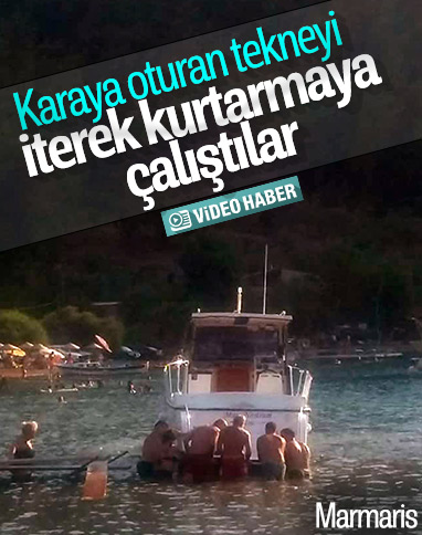 Muğla'da karaya oturan tekneyi kurtarma çalışması