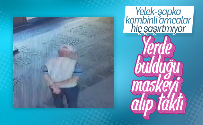 Yerde bulduğu maskeyi takan yaşlı adam kamerada