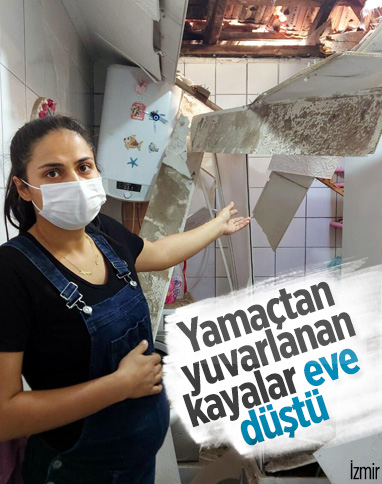 İzmir'de yamaçtan kopan kaya parçaları çatıyı delip eve girdi