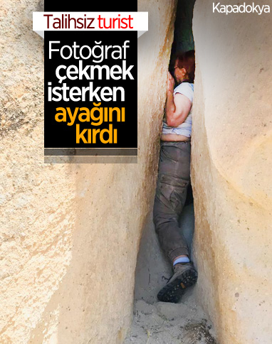 Kapadokya'da fotoğraf çeken turist kayalıklar arasında sıkıştı