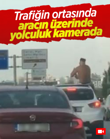 Antalya’da, aracın üzerinde yolculuk yapan şahıs kamerada