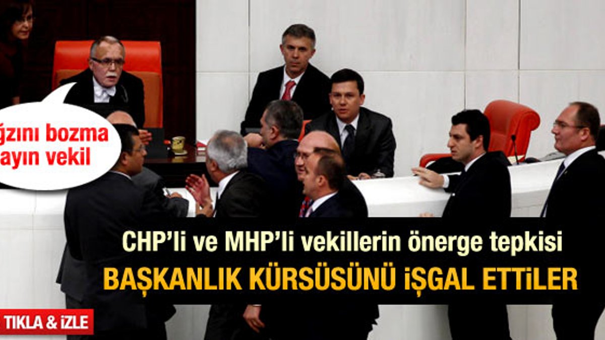 CHP'li ve MHP'li vekiller Meclis kürsüsünü işgal etti