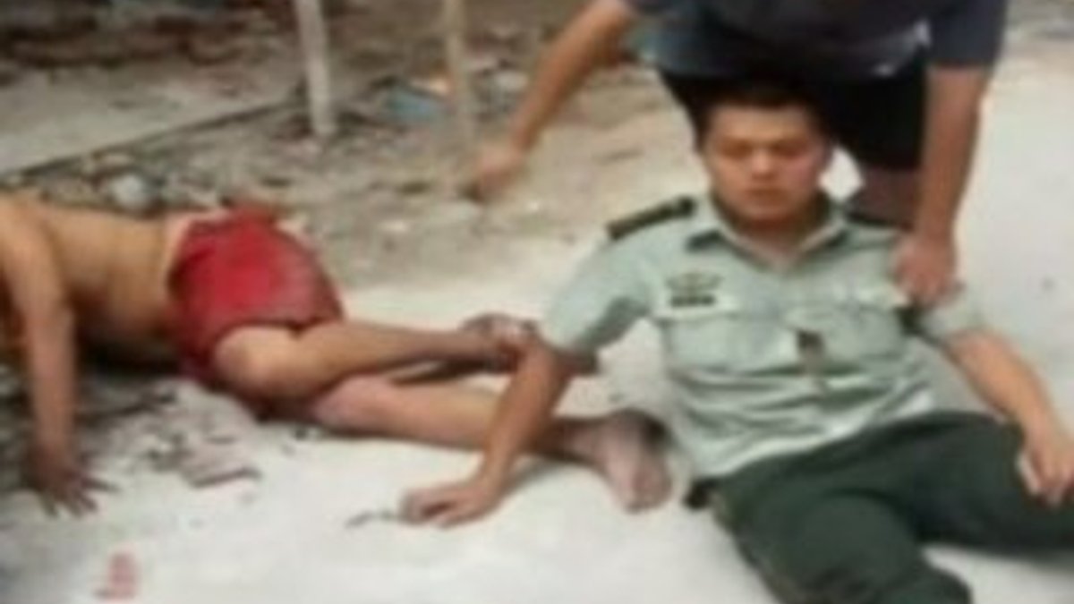 Çin'de intihar eden adam polisin üzerine düştü