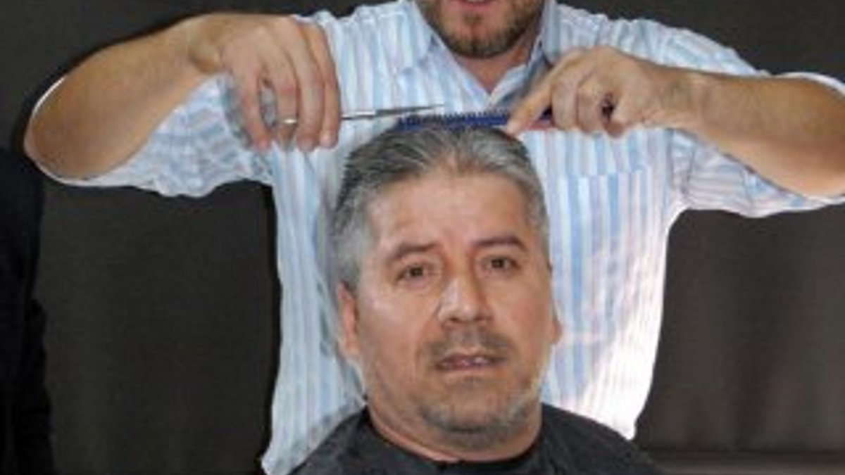 MHP'li Talat Yılmaz iddiayı kaybedince saçlarını kestirdi