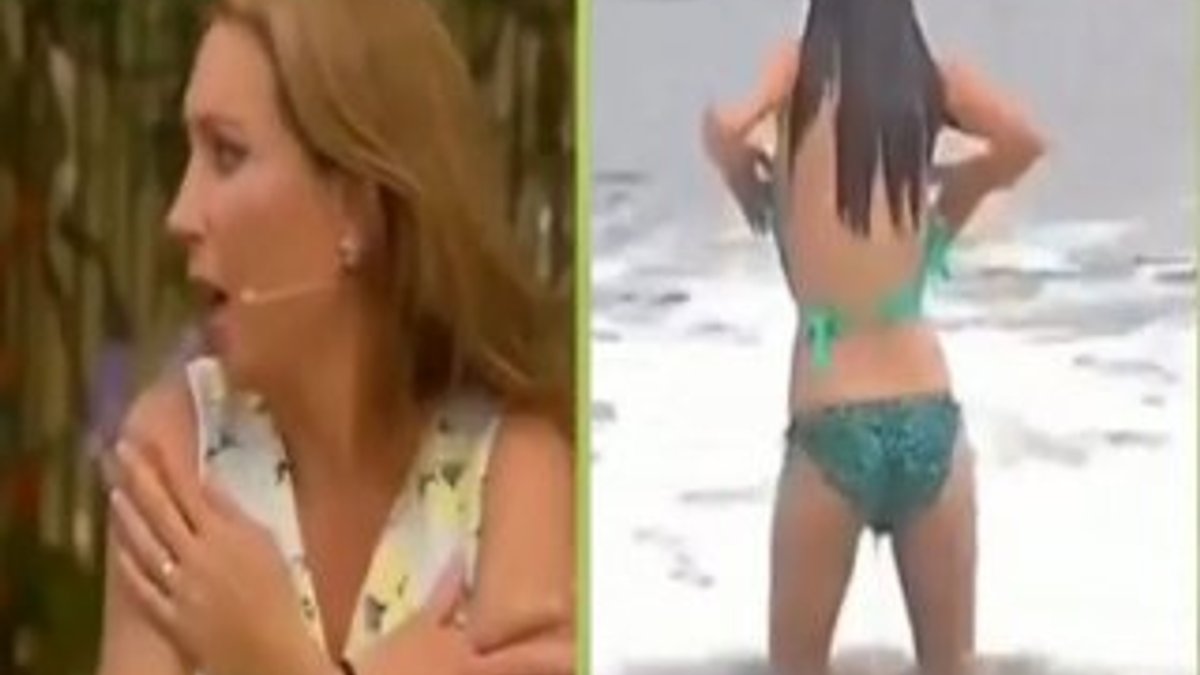 Canlı yayında okyanusa giren muhabirin bikinisi düştü
