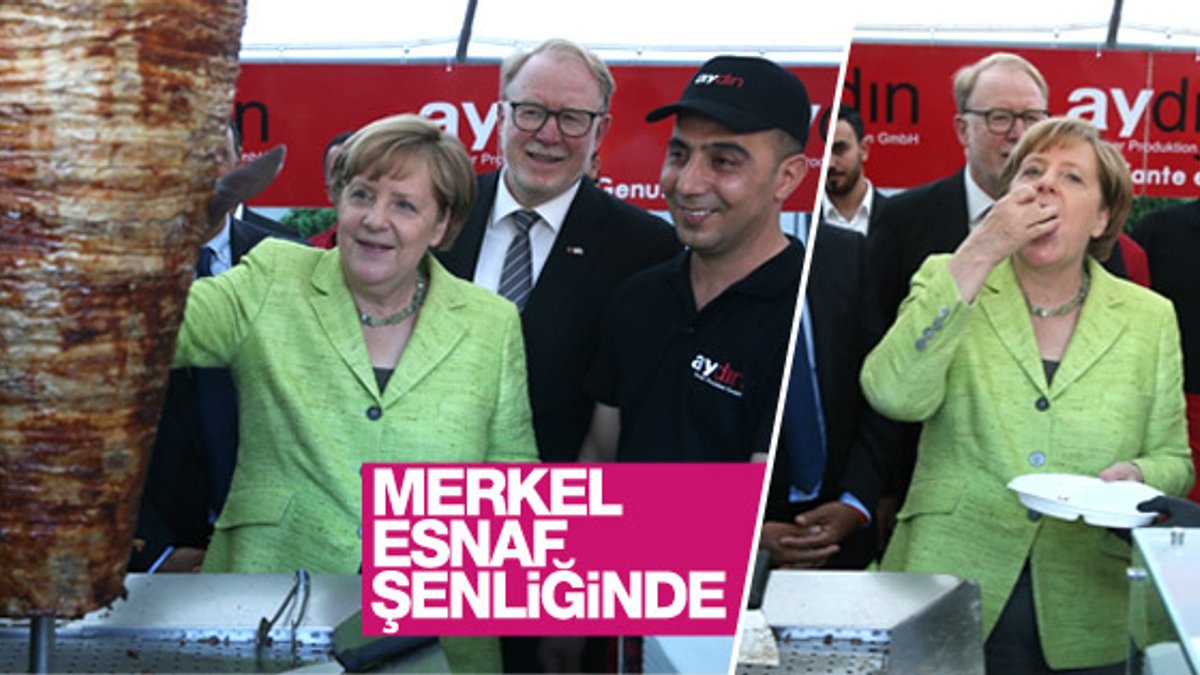 Merkel esnaf şenliğinde döner kesti