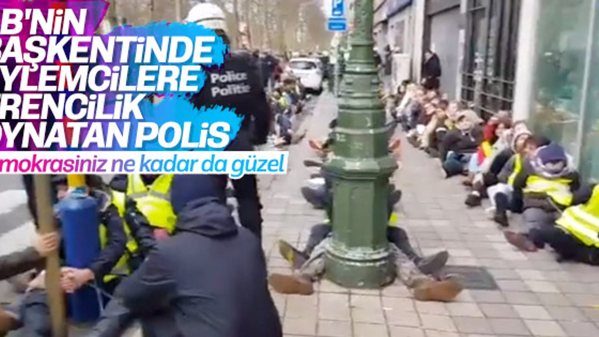 Belçika polisinden göstericilere ters kelepçeli eziyet