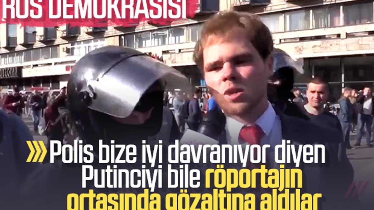 Rus polisi röportaj yapan eylemciyi de gözaltına aldı