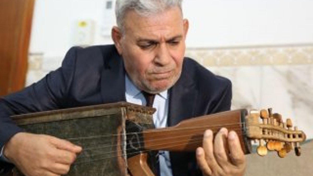 Irak'ta öğretmen silahı müzik aletine çevirdi