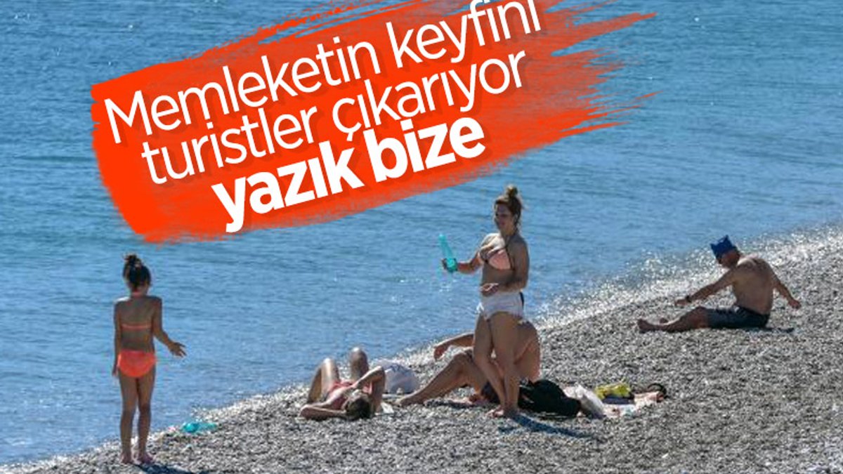 Antalya'da güneşi gören turistler denize koştu