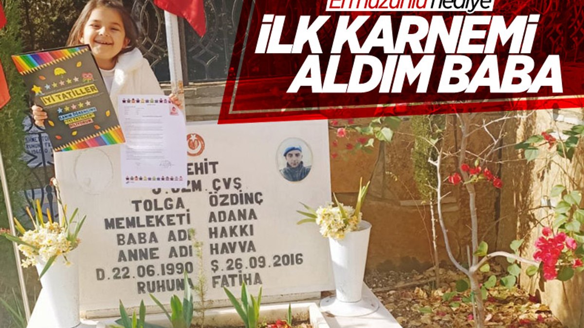 İlk karnesini, şehit düşen babasının mezarına götürdü