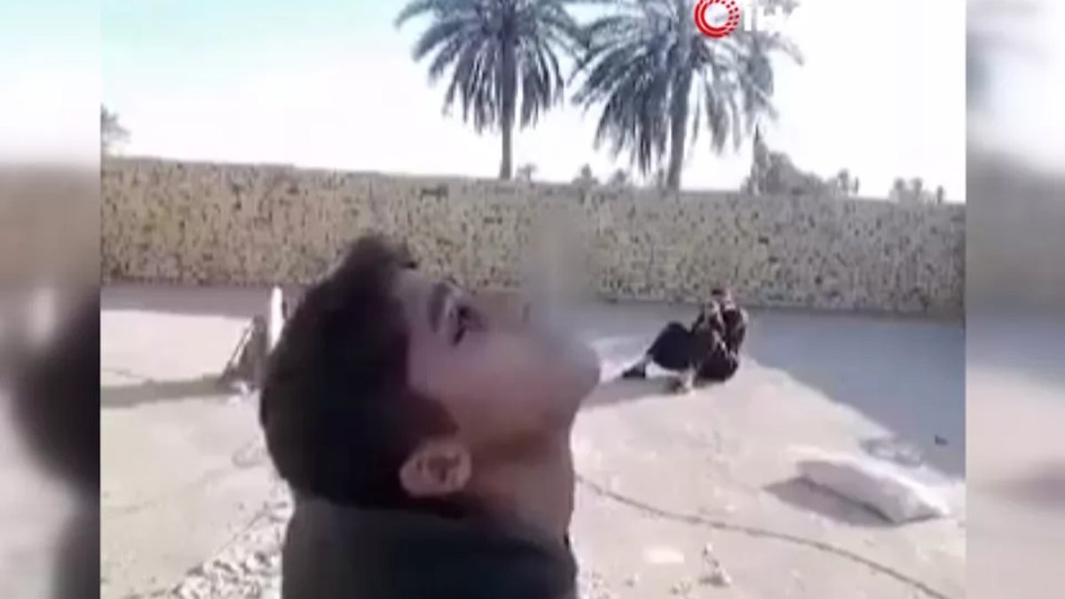 Iraklı baba, oğlunun ağzındaki sigarayı mermiyle vurdu