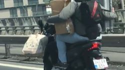 Elinde bavul, altında motorla İstanbul trafiğine çıktı