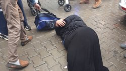 Abused pregnant woman on the street in Batman