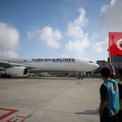 Milliler bayraklarla karşılandı