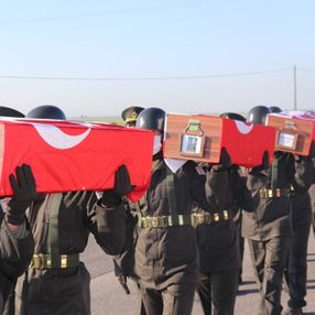 KKTC'de katledilen 14 şehit, 46 yıl sonra toprağa verildi