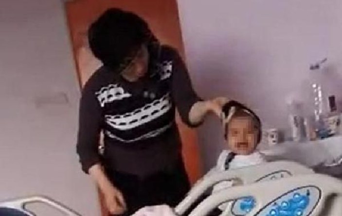 Hasta bebeğini ağladığı için döven kadın serbest