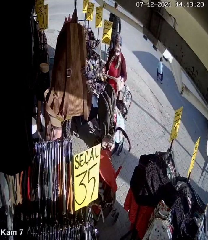 d Yere düşen cüzdanı çocuğa aldırıp, cebine attı, güvenlik kamerasına yakalandı -1