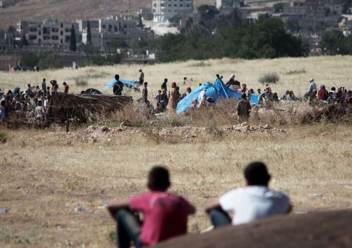 Kobani'de silah sesleri yükselmeye devam ediyor