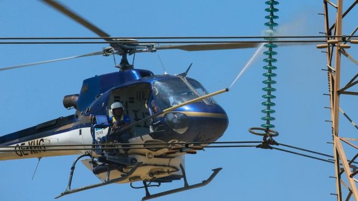 Elektrik hatlarının temizliği helikopterlerle yapılıyor
