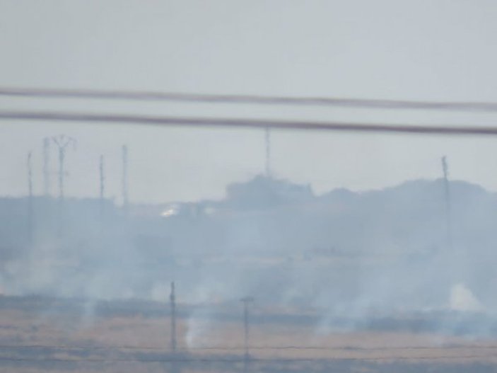 YPG'li teröristler SİHA'lara karşı lastik yakıyor