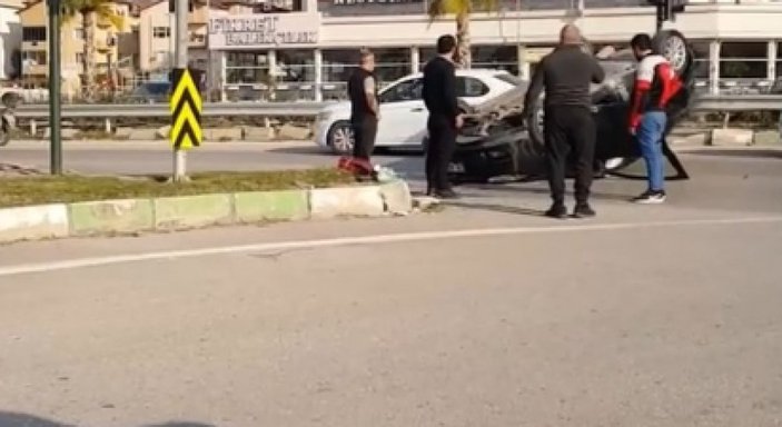 Bursa'da virajı alamayan sürücü takla attı