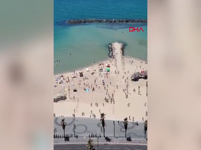 Plajdaki İsraillilerin sığınaklara koştuğu anlar kamerada