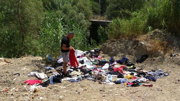 Manavgat'ta yardım için gönderilen kıyafetler dere kenarına atıldı