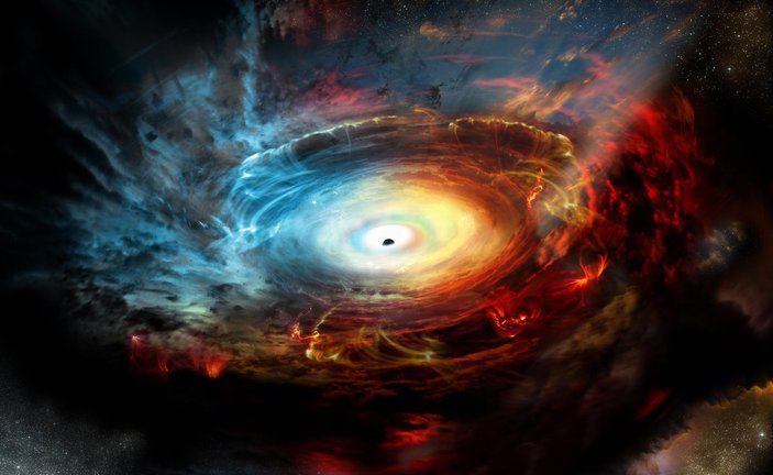 Kozmik toz bulutunun ardında süper kütleli kara delik bulundu