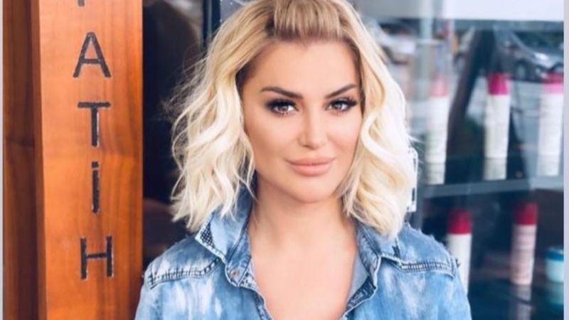 Songül Karlı, derin göğüs dekolteli gömleğiyle poz verdi