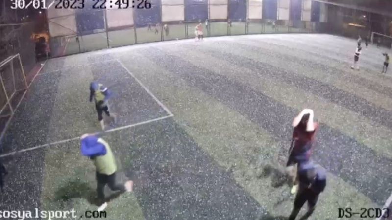 Antalya'da dolu yağışına halı sahada yakalandılar